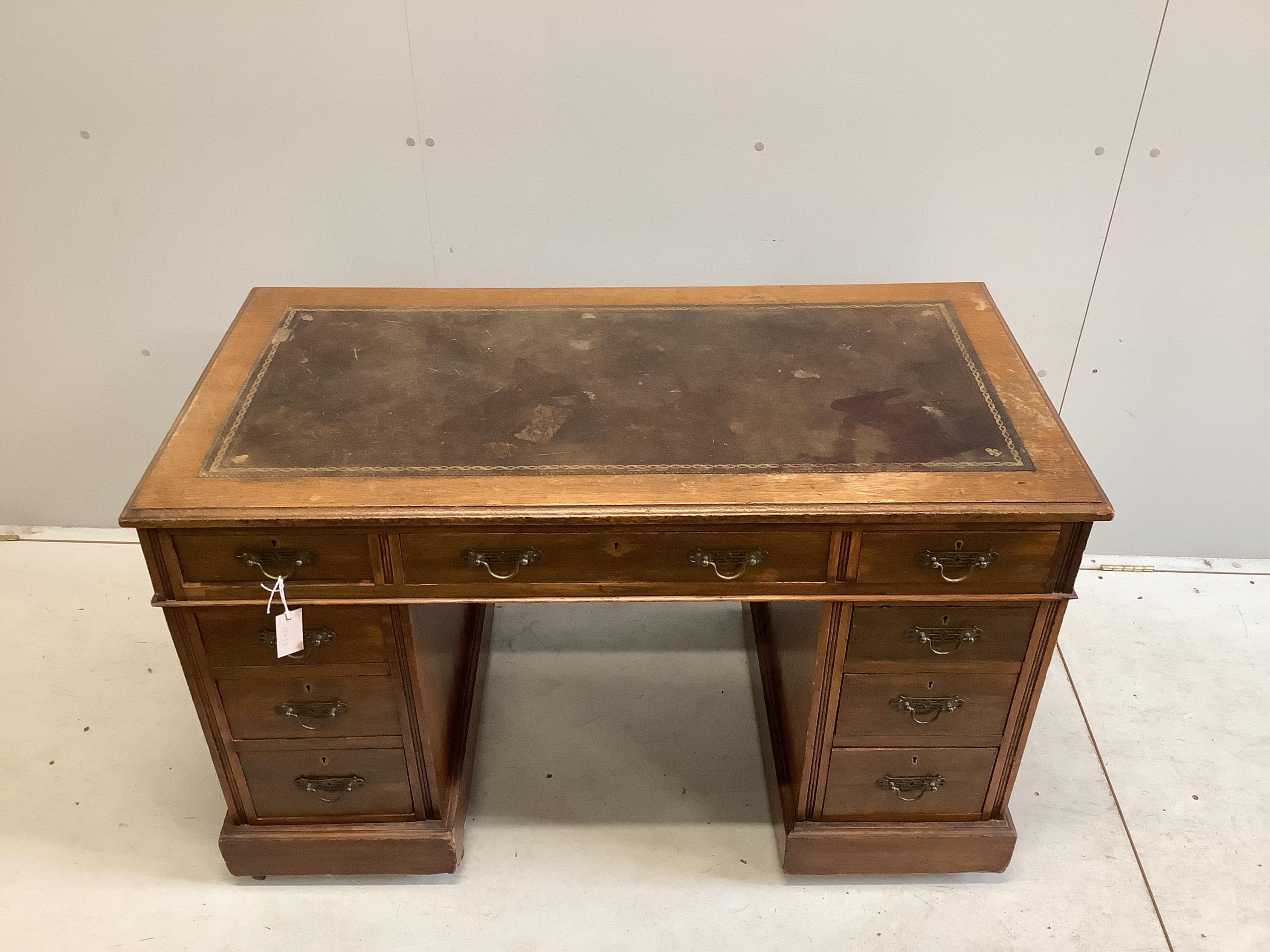 A late Victorian oak pedestal desk, width 120cm, depth 64cm, height 73cm. Condition - poor to fair